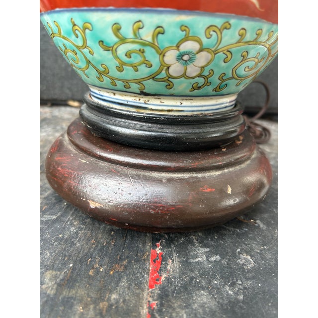 An exceptional antique Japanese Kutani porcelain table lamp presenting highly detailed hand-painted artistry on a vivid...