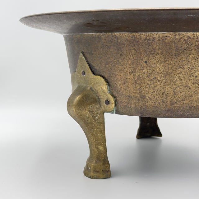 Korean brass brazier, also known as a hwaro or tripod fire pot, dating to the late 19th to early 20th century. These were...