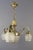 Elegant French Art Deco chandelier from the 1920s with three brass arms each with frosted glass shade and porcelain socket...