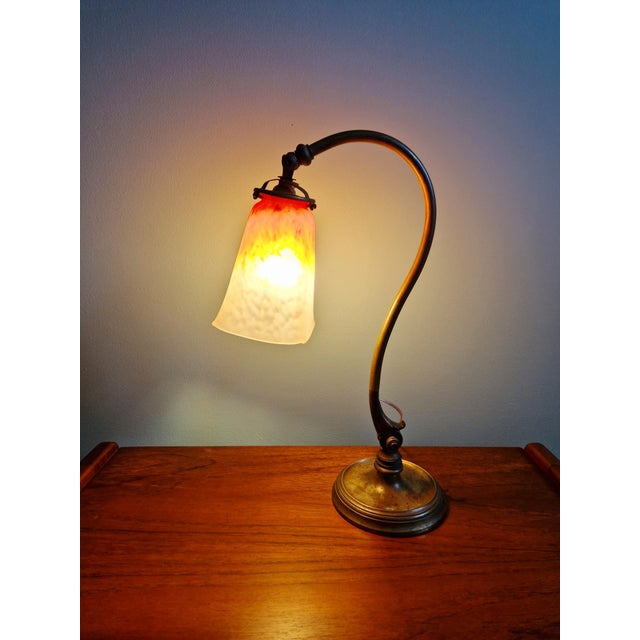 Art Deco bronze desk lamp with a glass shade signed Schneider (from the French glassworks of the Schneider brothers),...