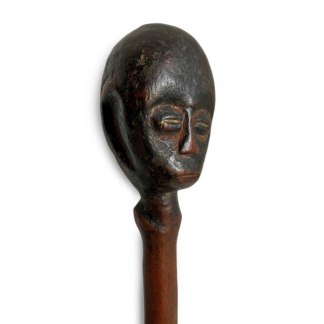 Finely hand-carved vintage Lega figural stopper from the Democratic Republic of Congo, likely associated with the...