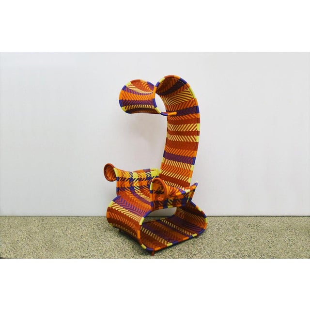 Afrika throne handcrafted African production 2000s. Painted metal frame with interwoven multicolored handmade polyethylene...