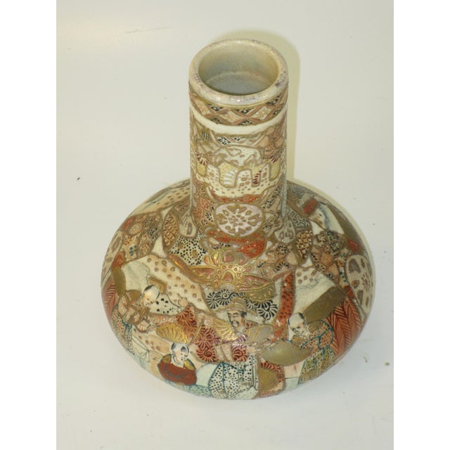 This antique vase is of Meiji-era Japanese origin, specifically from Kyoto Satsuma. Made of ceramic, it features a multi-...