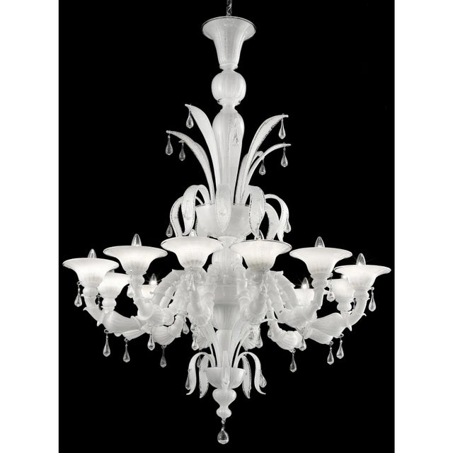 Contemporary Lively white “Cà Rezzonico” Murano Glass Chandelier. The arms are working in traditional working “Cà...