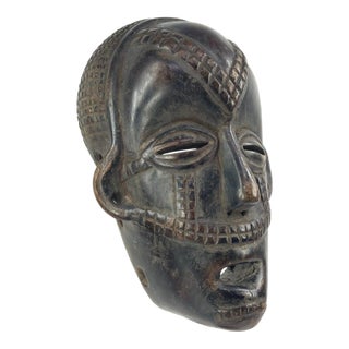 Early 20th Century Tabwa Wood Mask with Awl Holes For Sale