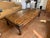 A substantial Spanish Colonial Revival coffee table, showcasing bold craftsmanship and old-world character. Constructed...
