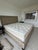 Solid quality wood construction (includes solid slats for placement of mattress). Upholstered in rich linen with subtle...