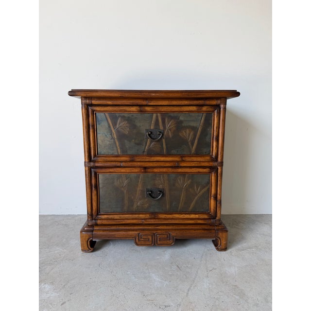 Bring timeless Asian-inspired elegance to your space with this vintage Chinese-style two-drawer nightstand. Crafted with a...