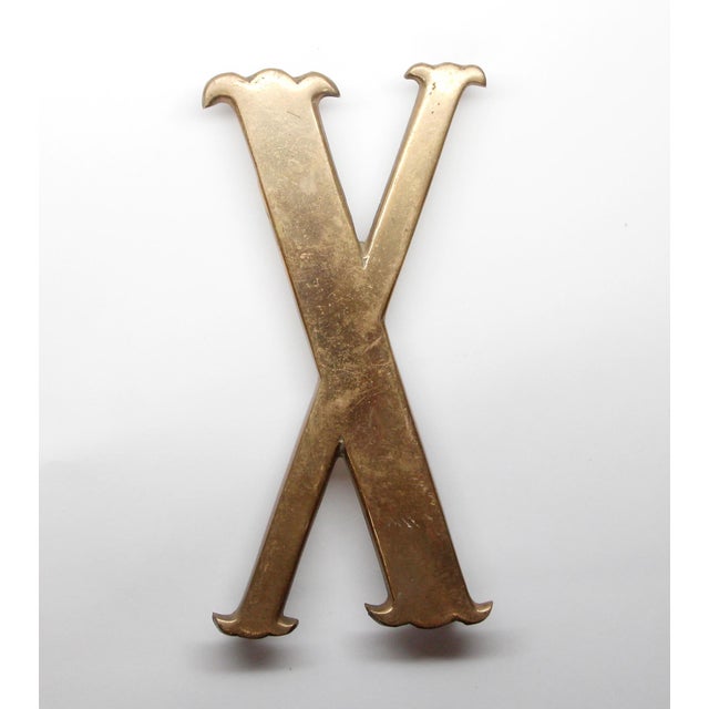 Solid polished brass X, Y, and Z letters with four prongs on the back. They can be used as a trivet or on a wall...