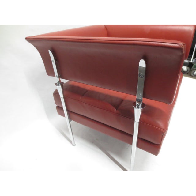 The Poltrona Frau Hydra Castor Leather Armchair, designed by Luca Scacchetti in the 1990s, features a sleek, modern design...