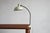 Table mount desk lamp manufactured in 1950s. Original Kaiser Idell lamp designed by Christian Dell in the 1930s. All in...