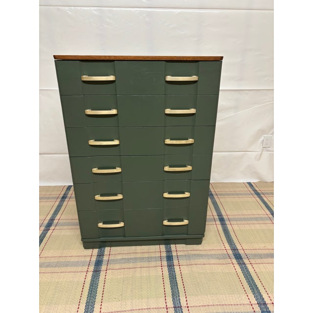 Vintage multi drawer chest painted in a deep hunter green by professional paired with contrasting gold handles and a...