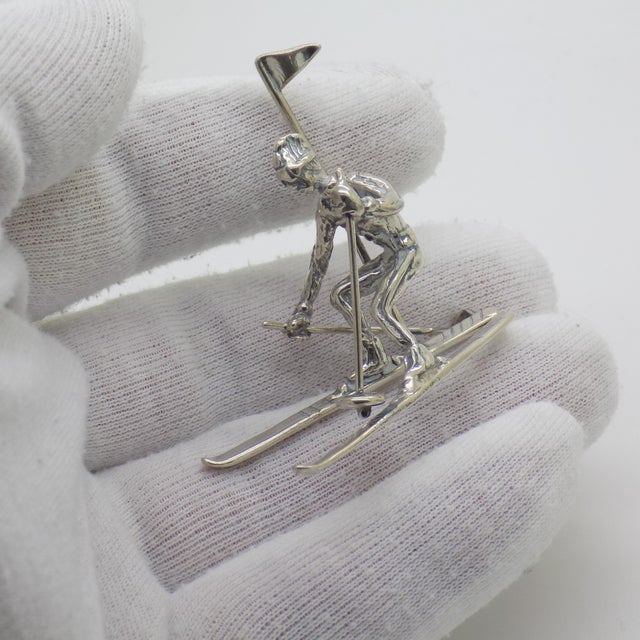 A vintage miniature portraying a slalom skier, handcrafted in Continental Silver (800/000) in Italy during the 1970s and...