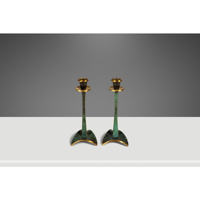 Introducing a set of artfully-crafted candlestick holders forged from solid brass and painted with fascinating jade-like...