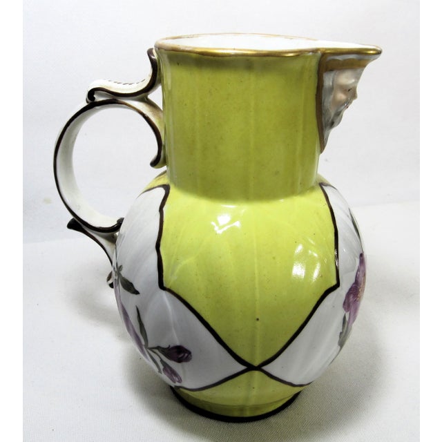 This is a very unique and old little pitcher. Hand painted with sweet flowers and there is a face on the spout. The...