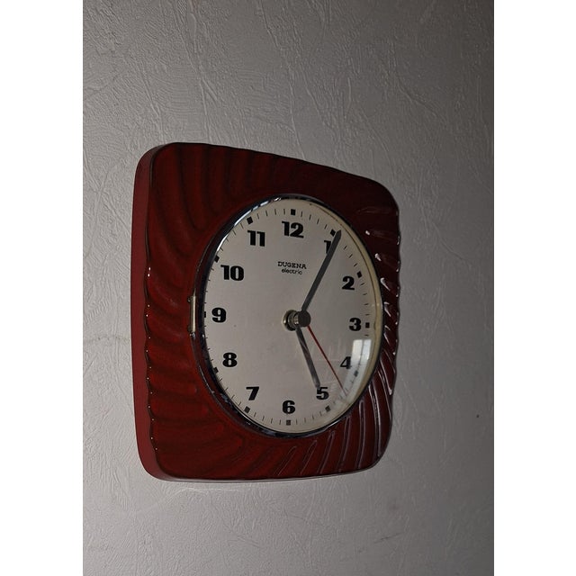 Vintage Wall Clock with Red Ceramic Case by Dugena, 1970s, in Very Good conditions. Designed 1970 to 1979 This piece has...