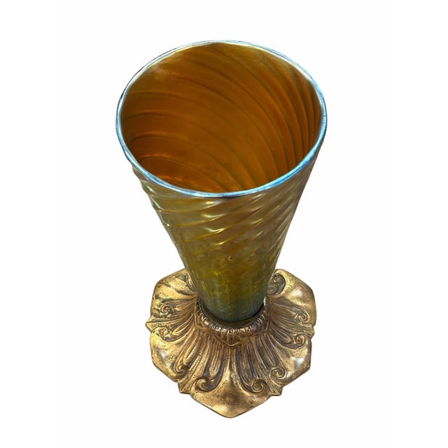 Louis Comfort Tiffany trumpet vase featuring a spiral-twisted, gold iridescent Favrile glass insert set into a cast gilt...