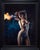 This artwork depicts a figure poised gracefully, emanating a vibrant burst of flame from her fingertips. The interplay of...