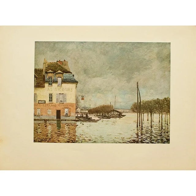 A lovely vintage full color Impressionist print after oil painting "Flood at Port-Marly" by Alfred Sisley. Comes from a...