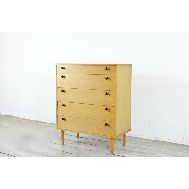 Mid-Century Modern Teak Tallboy from Avalon, 1960s, in Very Good conditions. Designed 1960 to 1969 This piece has an...