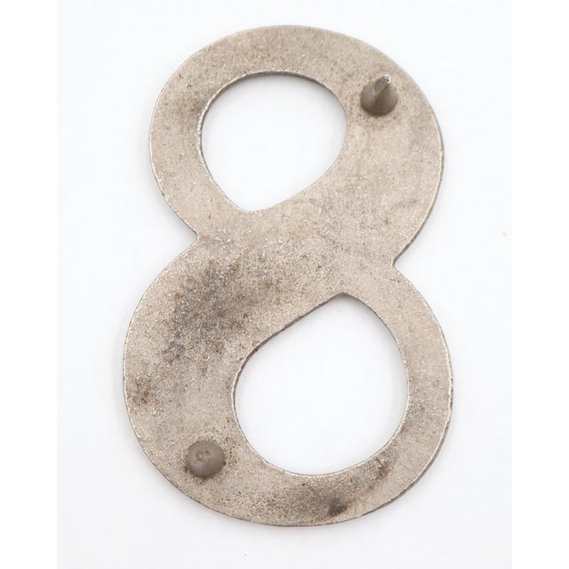 Vintage brushed steel numeral 8 outdoor house or building marker with two prongs on the back. Good condition with surface...