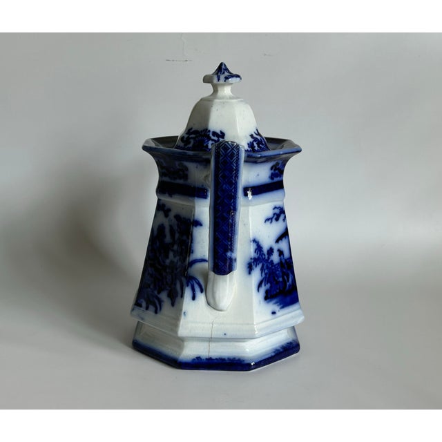 An important early Victorian Flow Blue teapot produced by Davenport at Longport, Staffordshire. The Amoy pattern,...