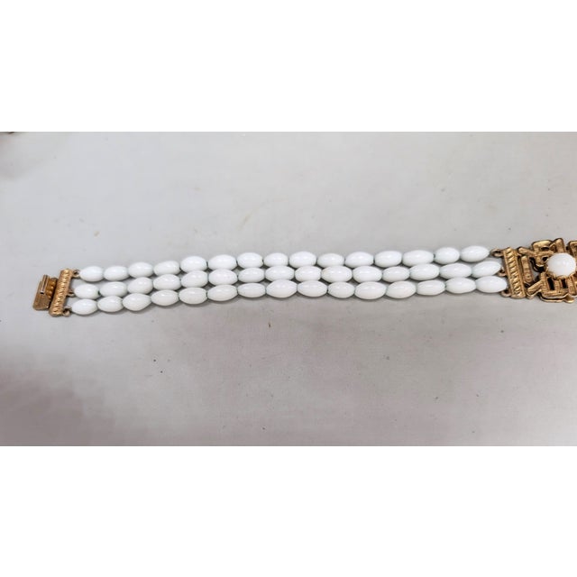White Vintage 1960s Signed Napier Goldtone & White Beaded Asian Influenced Bracelet For Sale - Image 8 of 13
