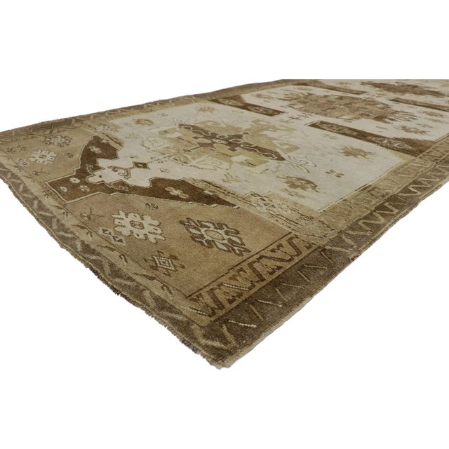 Vintage Turkish Kars Gallery Rug 05'09 x 12'08. With its warm hues and beguiling beauty, this hand-knotted wool vintage...