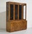 This Mid Century Campaign Style Burl Front Lighted Display Curio Cabinet by Hickory Manufacturing is a stunning blend of...