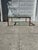 We have a beautiful vintage Hollywood Regency coffee table for sale. Featuring a brass tone frame, a thick glass top,...