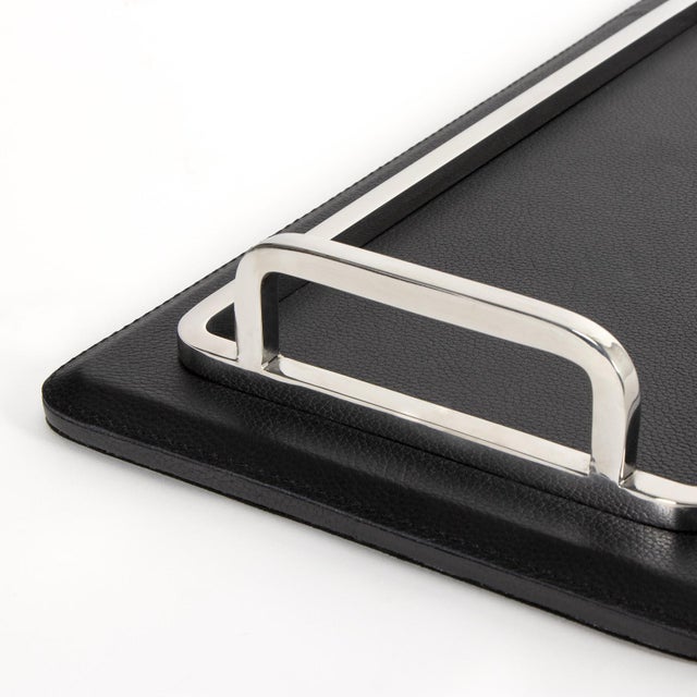 Available with brass or nickel accents, the Greyson Rectangle Trays are crafted from smooth, structured leather for a...