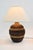 Discover the charm of mid-century design with this beautiful pair of very large bulbous ceramic lamps with heavy relief,...