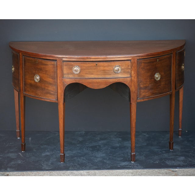 A fine English sideboard server (or serving console) of flame mahogany from the Regency period - featuring a demi-lune or...