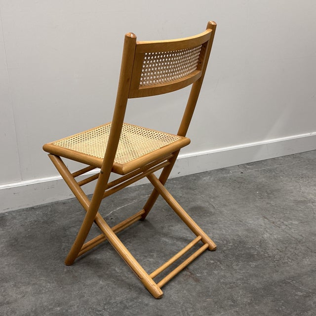 An exceptional set of four folding chairs crafted in Belgium, showcasing refined craftsmanship and understated luxury....