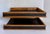 Here is a beautifully designed mid-century modern two-tier desk organizer, likely dating to the 1960s, featuring a warm...