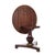 This distinguished English Regency tilt-top table, crafted from rich rosewood, dates to approximately 1840. The circular...