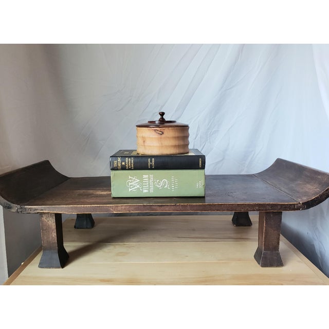 A hand-carved Northern Elm (Yumu) low altar stand from the late Qing Dynasty. Featuring classic everted "winged" ends and...