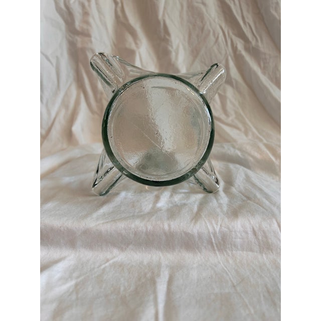 Sculptural swung glass centerpiece. Likely made in the 1980’s with an MCM influence giving it versatility for many decor...