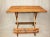 A mid-century folding natural bamboo table. Unusual table in that it folds flat from the center. Natural bamboo with a...