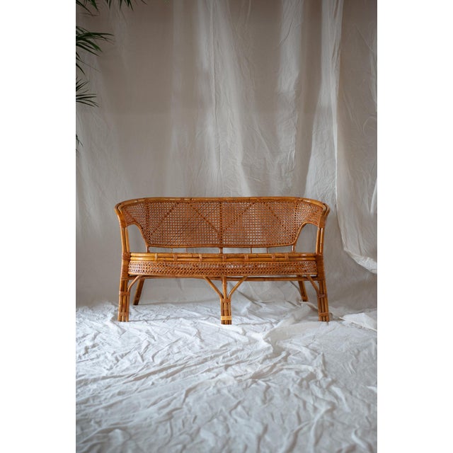Bamboo Bench – 1970s Product details Bamboo structure with rush bindings. Dimensions: 120 W x 90 H x 65 D cm Seat height:...
