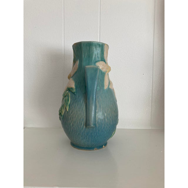 Vintage Roseville Art Pottery vase from the Clematis line in blue.