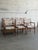 This set includes two captain chairs with sweeping armrests and four matching side chairs. The tailored geometric...