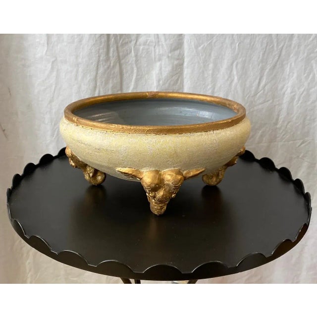 Ceramic Cream and Copper colors with 4 elephant head bases. Gray inside. Natural and distressed look. Payne imports.