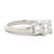A clean and timeless three-stone diamond ring with a modern edge. This piece features three well-matched princess-cut...