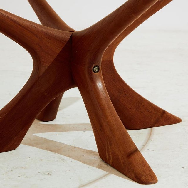 ‘Model T118’ coffee table from the 1960s designed by Illum Wikkelsø for Niels Eilersen. The table has a teak base with...
