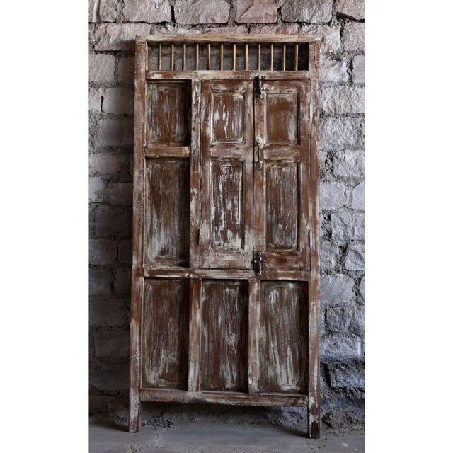 Bring timeless character to your home with this beautifully weathered reclaimed wood garden door, featuring hand-carved...