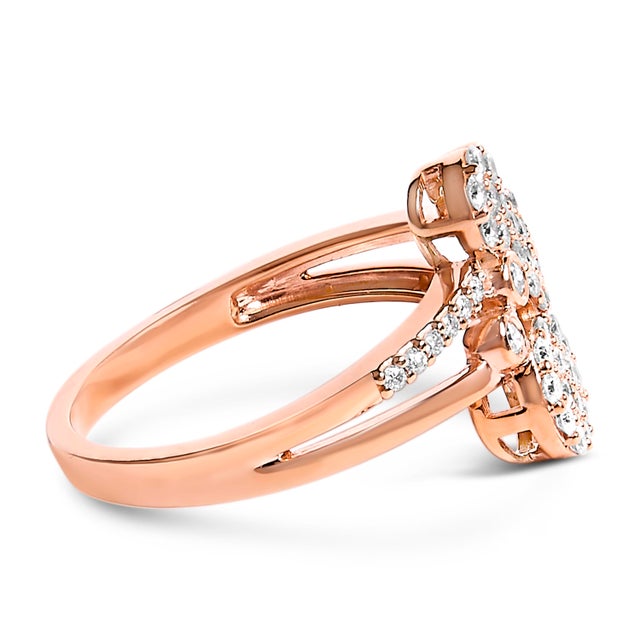 This lovely 14k rose gold plated sterling silver ring glitters with 1/2ct TDW of diamonds. A split ring band features...