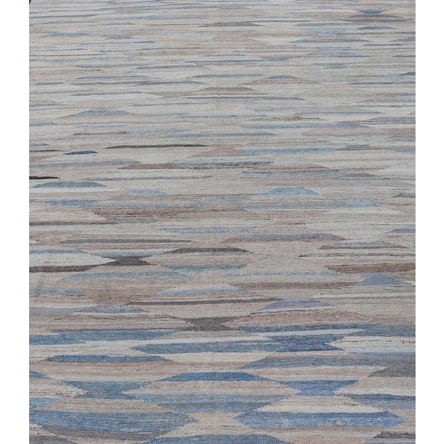 Modern and casual flat-woven Kilim rug in charcoal, gray, blue and brown diamond Afghan Modern Kilim Geometric design....