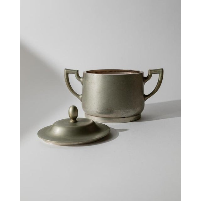 This vintage silver-plated lidded box from the 1950s is a refined decorative piece featuring an elegant classic form and...