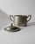 This vintage silver-plated lidded box from the 1950s is a refined decorative piece featuring an elegant classic form and...